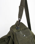 shoulder strap and metal clip closure on the vintage Army duffle - green canvas - leather - US