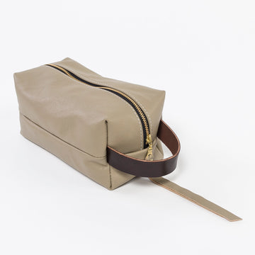sand leather dopp kit - workshop at venn + maker - handmade in house - durable design - cosmetic bag - brown leather handle