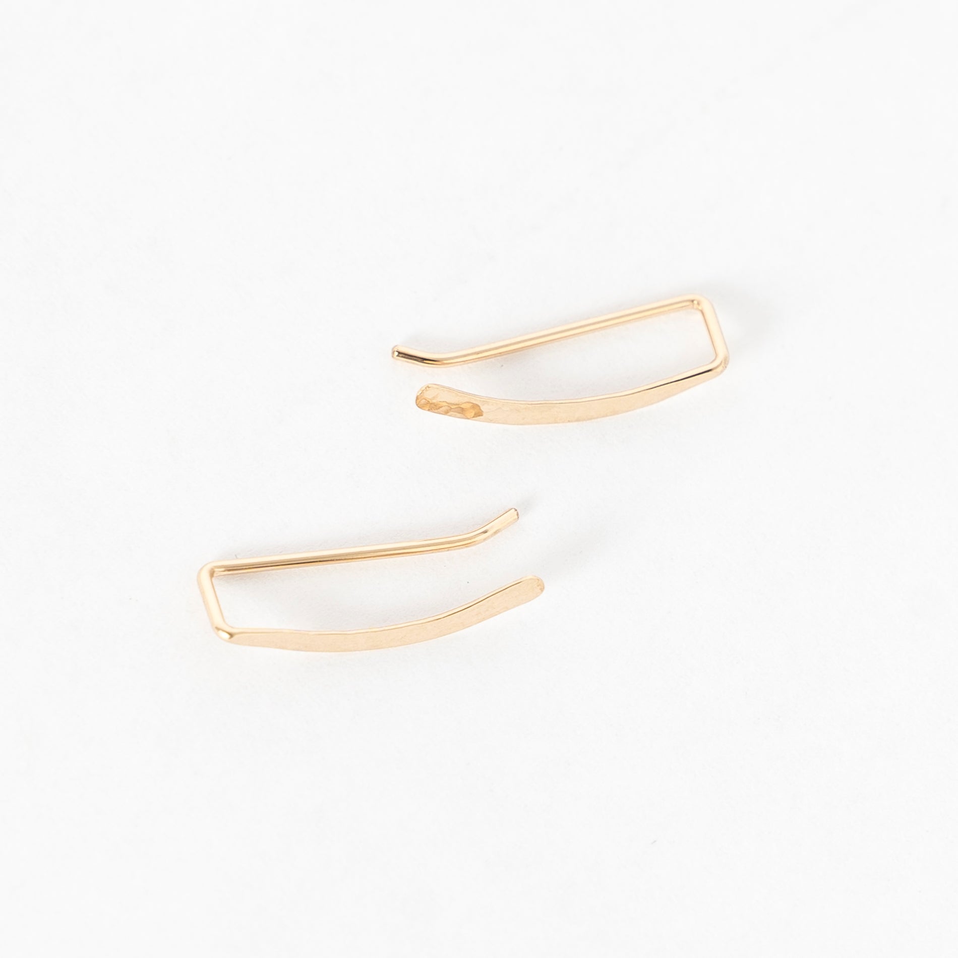 top view of the hammered sweep ear climbers in gold - crawlers - handmade in maine 