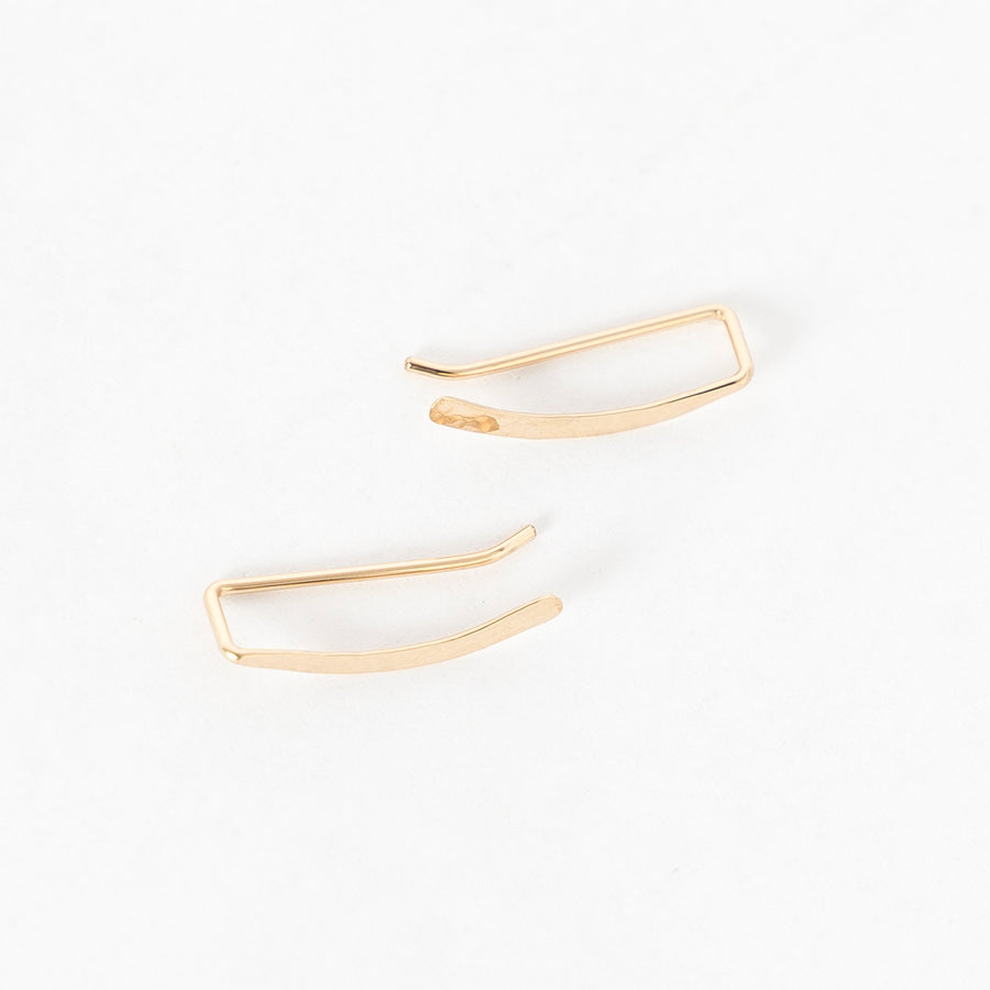 top view of the hammered sweep ear climbers in gold - crawlers - handmade in maine 