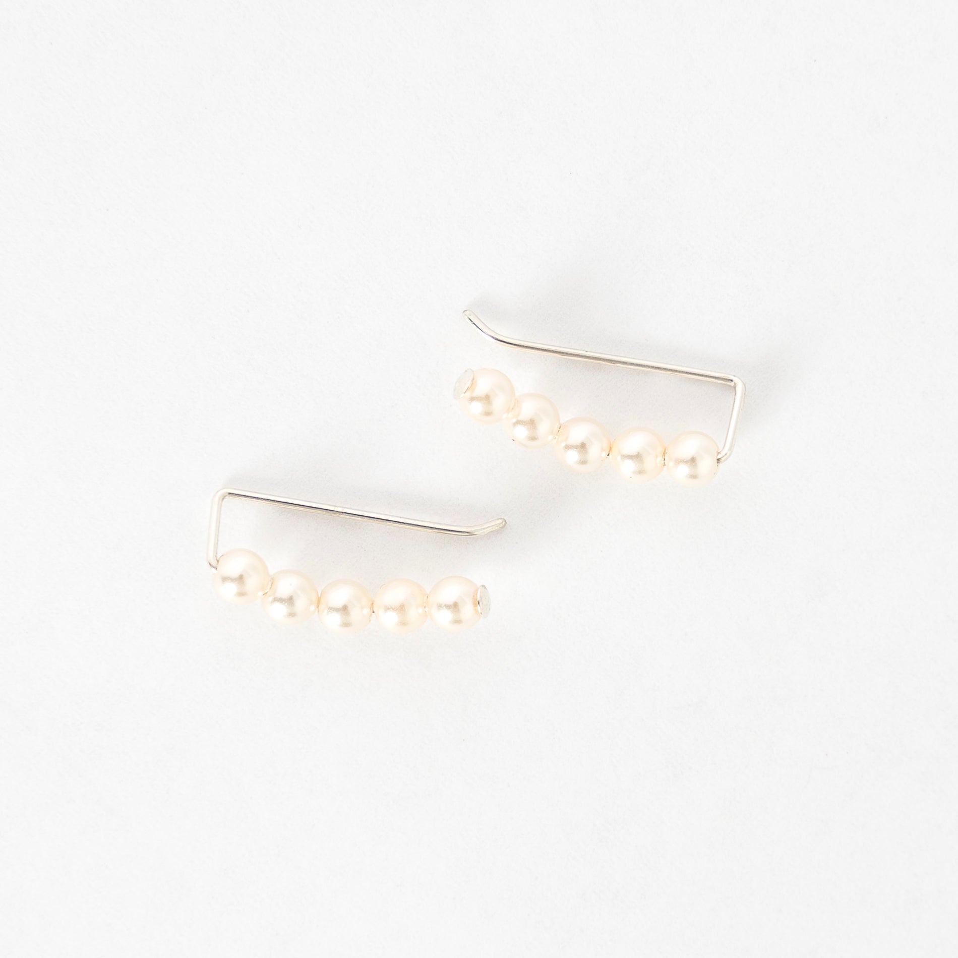 top view of the ivory pearl ear climbers - handmade in maine - jewelry - elegant earrings