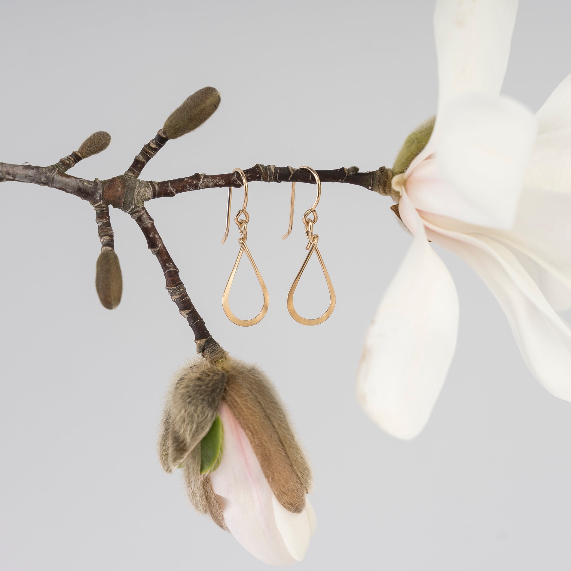 hammered gold teardrop earrings - handmade in Maine - lifestyle image - spring - blooming flowers 