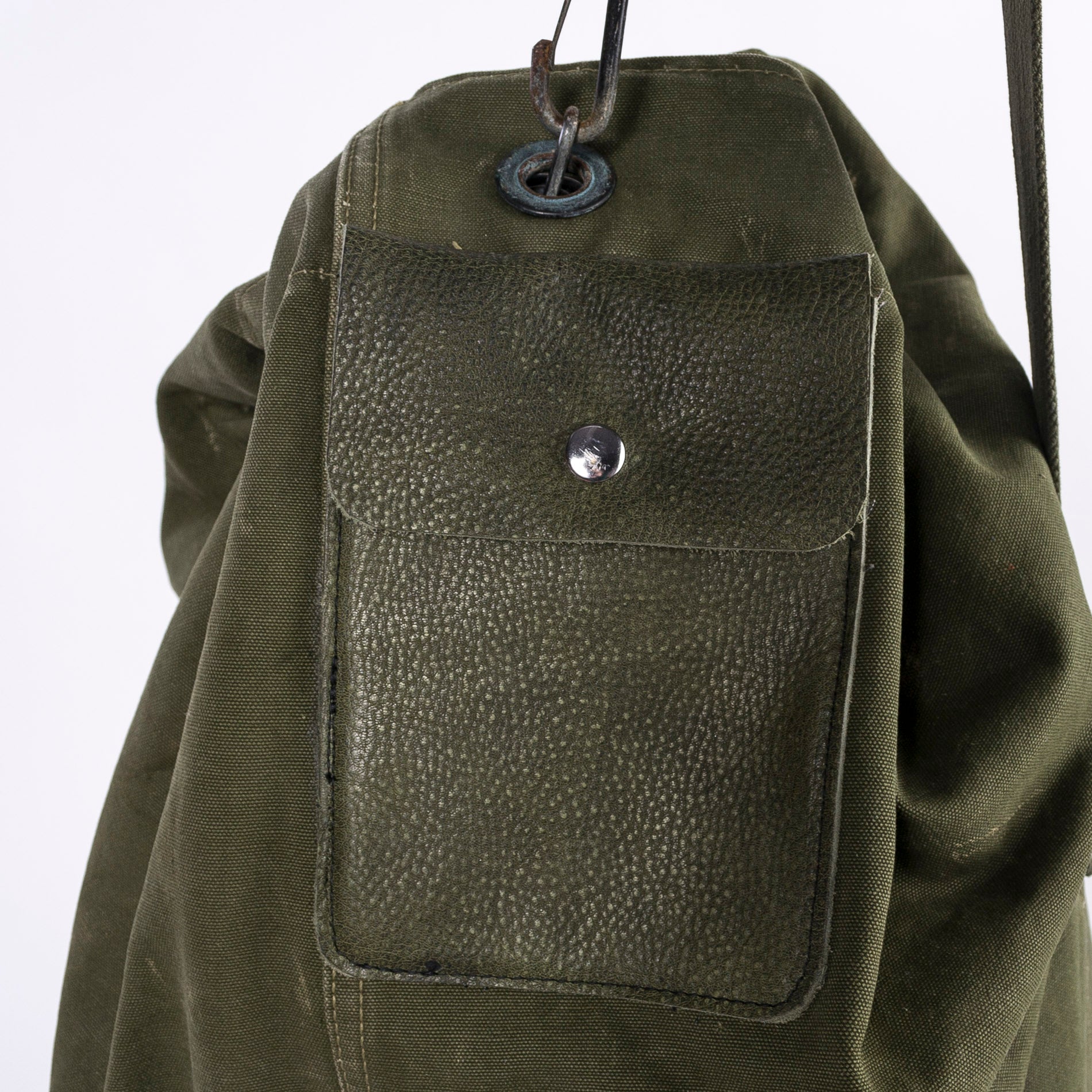 green leather pocket on the US army duffle - detail shot - up close image - vintage product