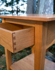 peaks point table in cherry - lifestyle image - natural wood - portland - maine - beckett street 