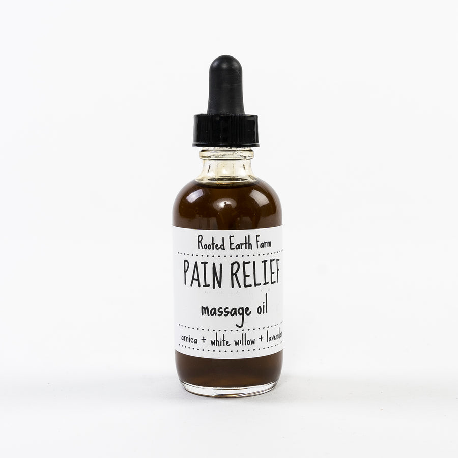 pain relief massage oil handmade in maine by rooted earth apothecary