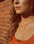 matte gold crescent moon pendant necklace - lifestyle shot - jewelry