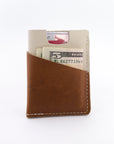 the brockman wallet with cash and cards - styled shot - in use 