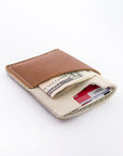 the brockman wallet with cash and cards - styled shot - inside shot 