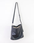 cross-body bag is a relaxed hobo design featuring a soft, slouchy, silhouette with enough room for storing everyday items