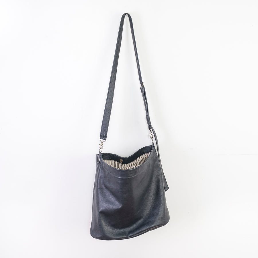 cross-body bag is a relaxed hobo design featuring a soft, slouchy, silhouette with enough room for storing everyday items
